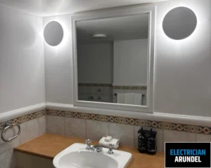 Image of a bathroom with stylish lighting and mirrors.
